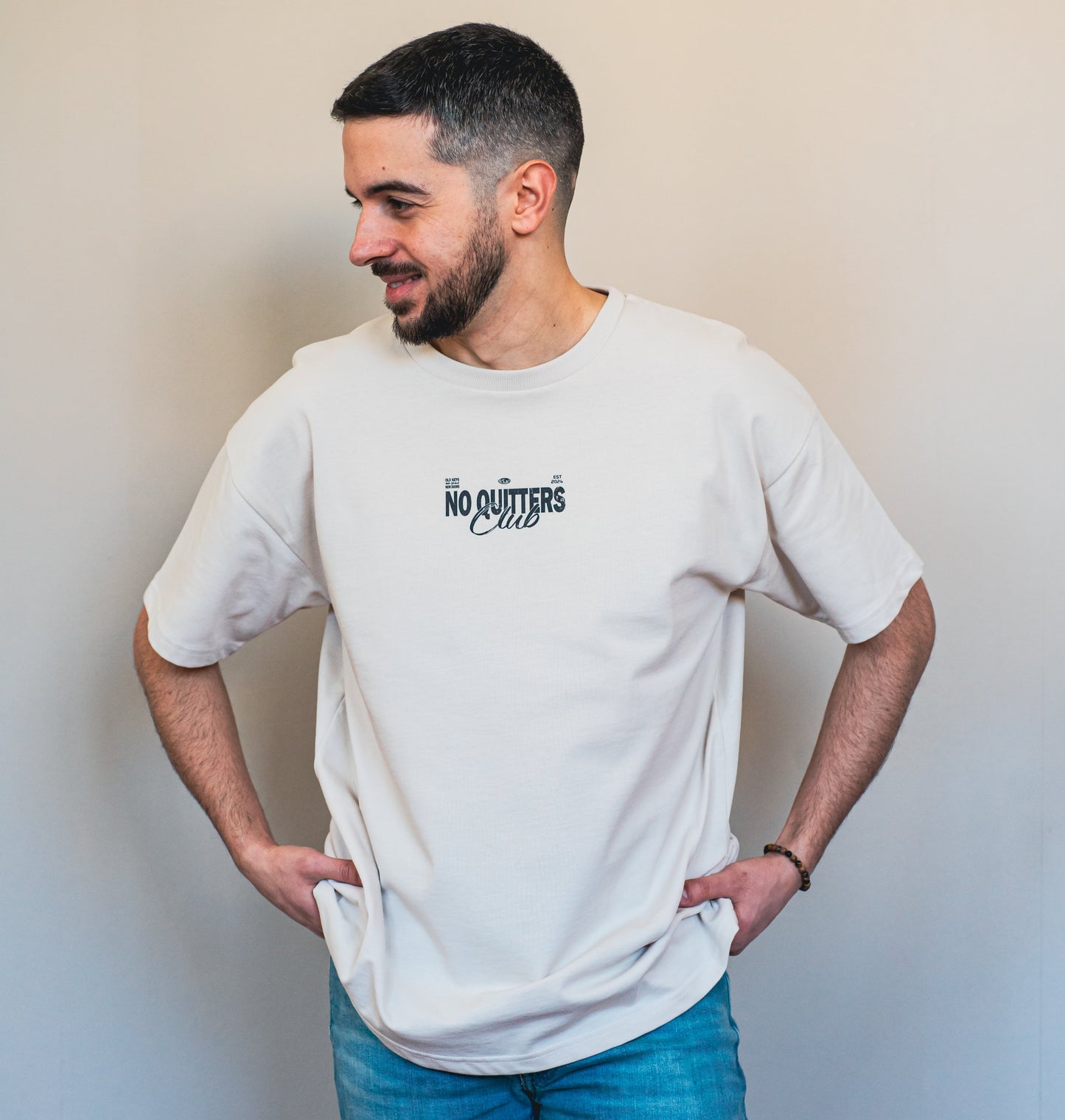 Empowering oat cream streetwear t-shirt with personal growth message, ethically produced in organic cotton for a clean, modern look.