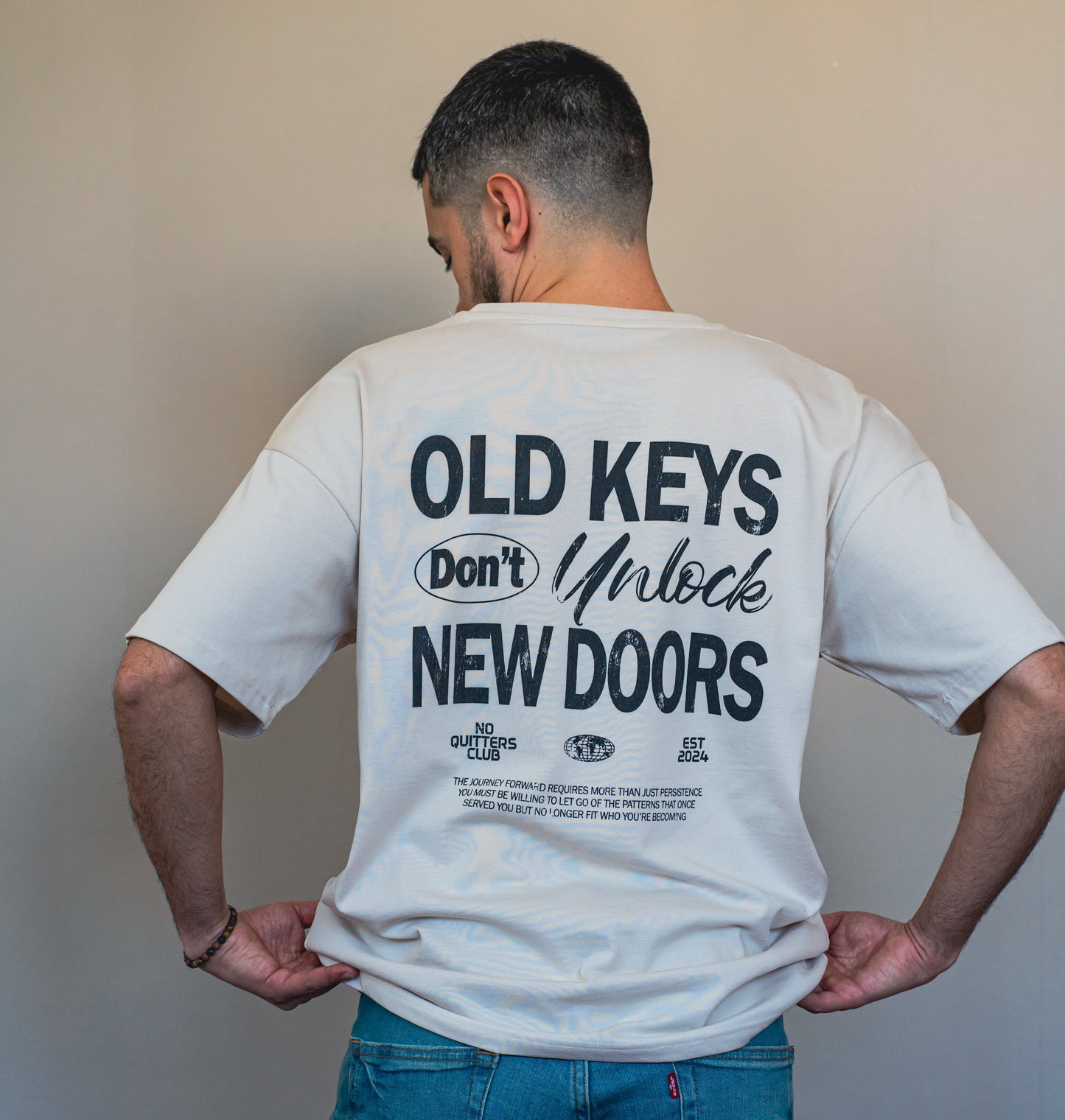 Unisex oat oversized t-shirt in organic cotton, featuring bold text design and relaxed fit for mindful fashion lovers.