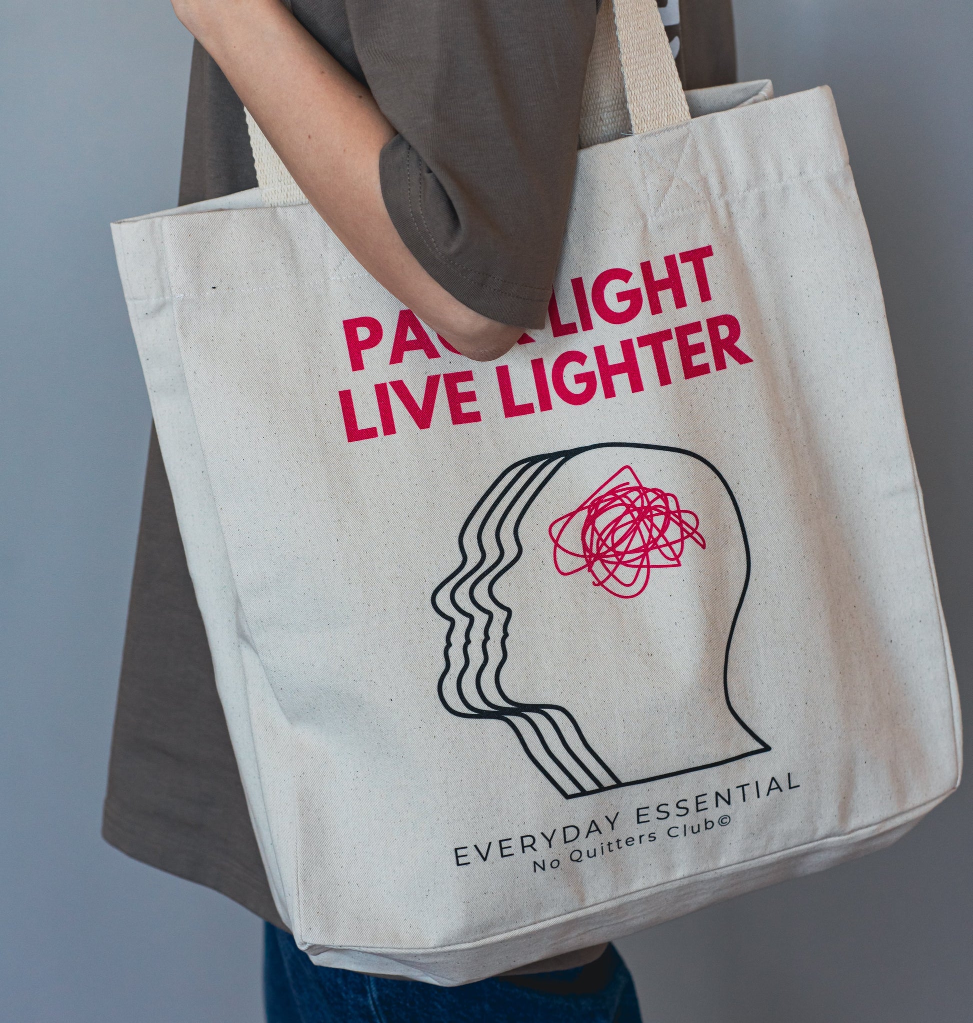 Lifestyle photo of oversized canvas tote with inspirational message – modern slow fashion piece for mindful living