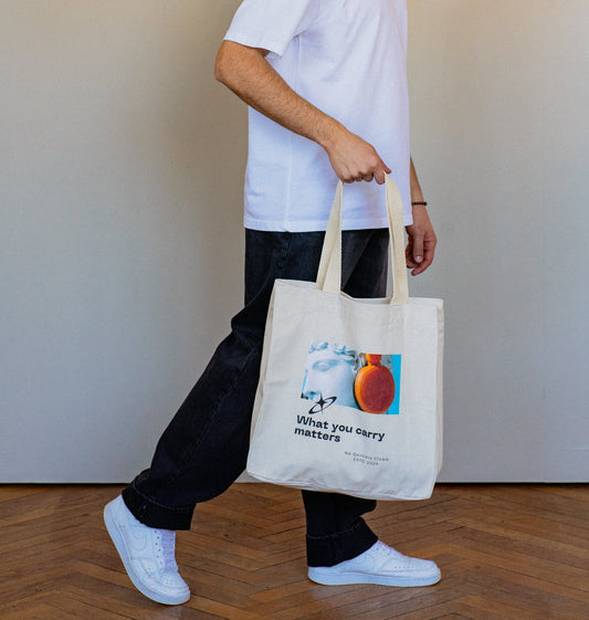 Spacious unisex tote bag in organic cotton, perfect for daily use while making a statement about what truly matters.