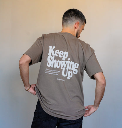 Back view of mocha brown motivational tee styled for modern streetwear