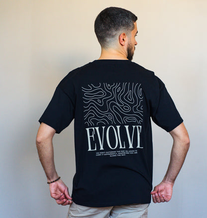 Streetwear-inspired black tee made of organic cotton with empowering EVOLVE message, perfect for everyday evolution.